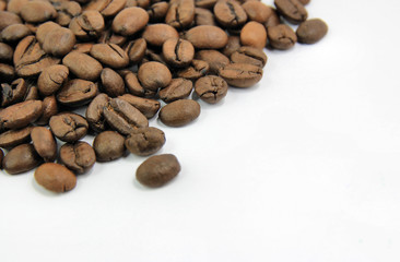 Coffee grains with cup close-up