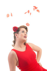 Blond girl with rose petals