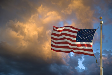 USA flag dark sky and clouds