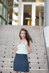 Obraz premium Fashionable woman by the staircase