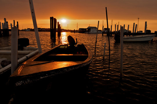 Sunrise shining behind a fishing boat in the Chesapeake Bay.