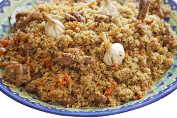 pilaf - national Uzbek food. rice and meat on a plate