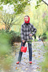 Beautiful blonde outdoors in coat and hat