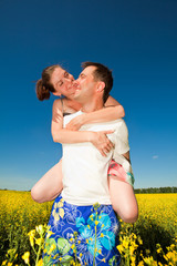 Young love Couple smiling under blue sky