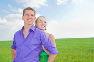 Young love Couple smiling under blue sky