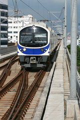 Modern Blue Sky Train coming to Station in Bangkok Thailand