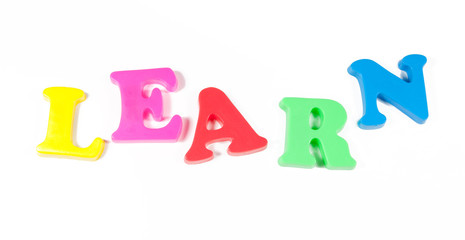 learn written in fridge magnets