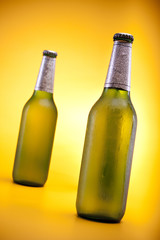 Bottle of bear on yellow