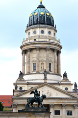 French church on Gendarmenmarkt Square and statute