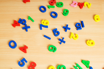 Children letters and digits on the table