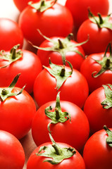 Red tomatoes arranged at the market stand