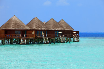 Maldives. .Villa on piles on water .