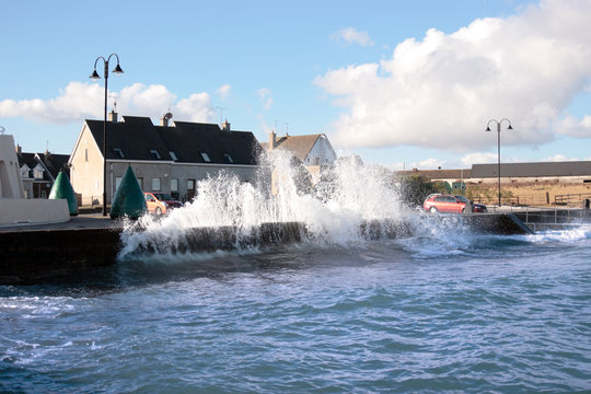 Waves Crashing Against Shore Wall