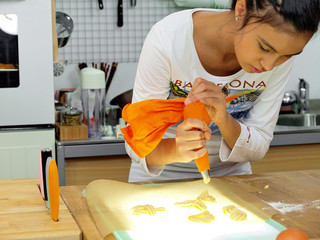 girl baking cookies at home