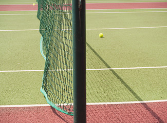 Close-up of tennis net with balls