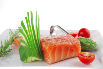 salmon fillet with vegetables and pesto sauce