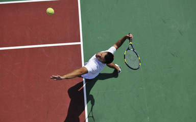 young man play tennis outdoor