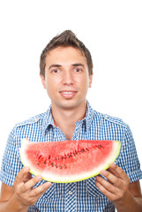 Smiling man showing watermelon