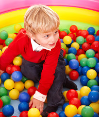 Fototapeta na wymiar Boy in colored ball.