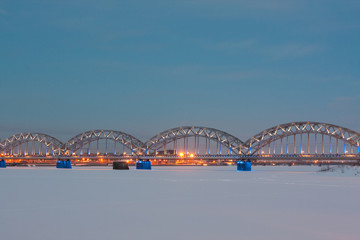 Railway bridge at night in winter