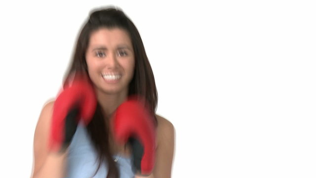 Self-assured asian woman with boxing gloves against white ba