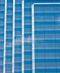 Light Hitting Blue and Grey Striped Building