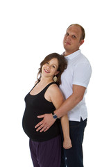 Fototapeta premium Young couple standing in studio setting isolated over white back