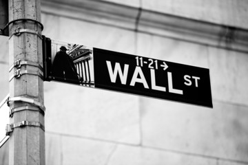 Wall Street road sign in the corner of New York Stock Exchange
