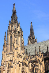 Fototapeta na wymiar The Tower of gothic St. Vitus' Cathedral on Prague Castle