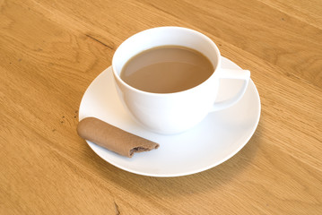 White Coffee and Biscuit on Table