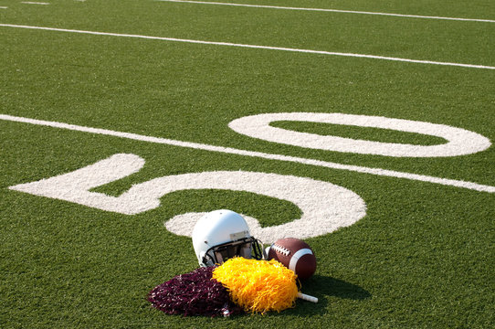 American Football Equipment and Pom Poms on Field