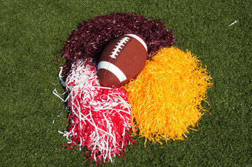American Football and Pom Poms on Field - 25094382