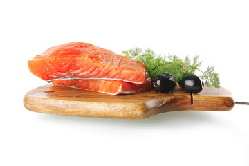 fresh smoked salmon on white plate with white cheese