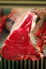 A raw bistecca Firoentina/T-bone at the Florence indoor market.