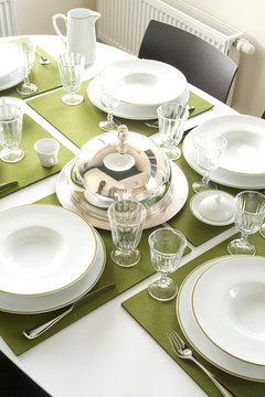 beautiful served table with green napkins