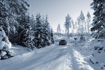 suv, car on snowy winter-road