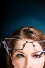 Woman looking at glasses