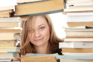 Young woman behind books