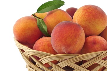 Fototapeta na wymiar peaches in the basket close up