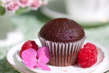 Chocolate muffin with raspberries