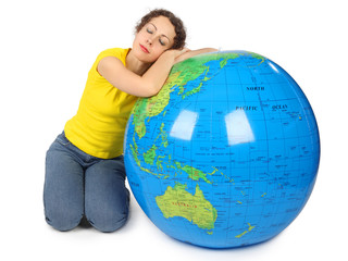 young beauty woman sitting near big inflatable globe