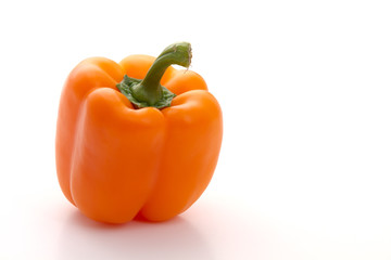 Orange paprika on white background