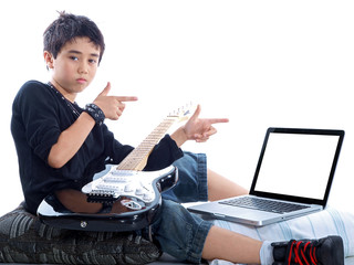 child with guitar pointing at computer display