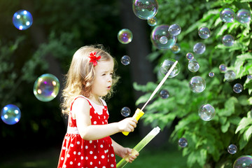 Cute little girl with bubbles