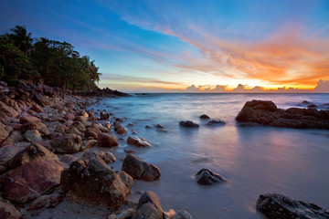 Fototapeta na wymiar Tropical sunset at the rocks. Thailand
