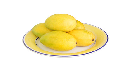 Naklejka na ściany i meble Fresh mangoes kept on the plate