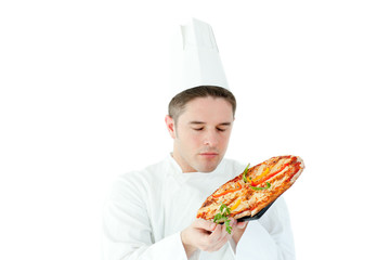 Caucasian male cook holding a pizza