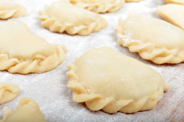 Fototapeta na wymiar Close up shot of dumplings during prepare process.