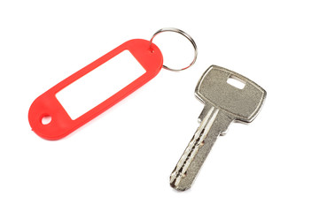 Key and red trinket with empty space isolated.