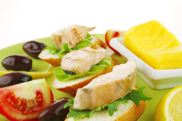fried salmon chunks on baguette